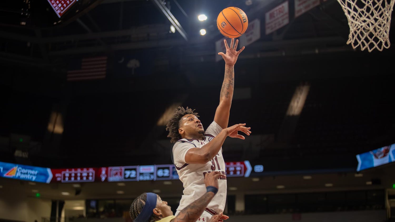 Junior forward Elijah Strong performs a layup during the game against Charleston Southern on Nov. 28, 2025. The Gamecocks defeated the Cavaliers 74-62.