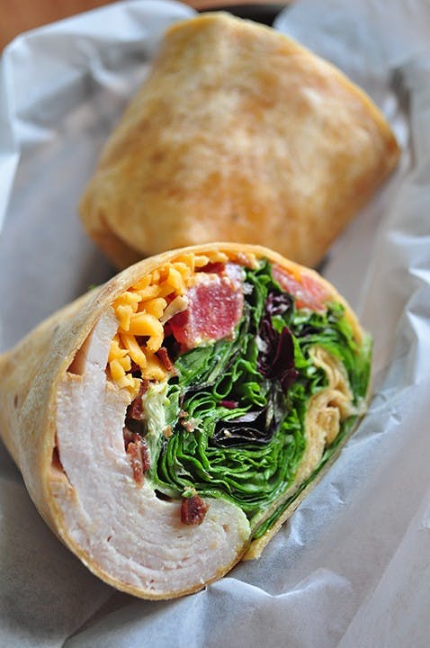 Honey Turkey Bacon ClubIngredients: Turkey, smoked turkey bacon, Vermont cheddar, fresh tomatoes, sprouts, mixed greens, homemade honey mustard...made with local honey. 