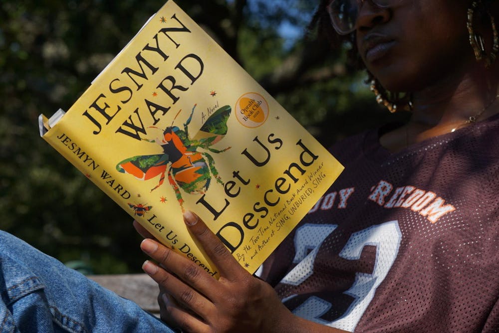 <p>A University of South Carolina student reads “Let Us Descend” by Jesmyn Ward on Sept. 24, 2023. Authors like Ward will participate in the free Fall Literacy Festival this upcoming week, where there will be book signings and other events.</p>