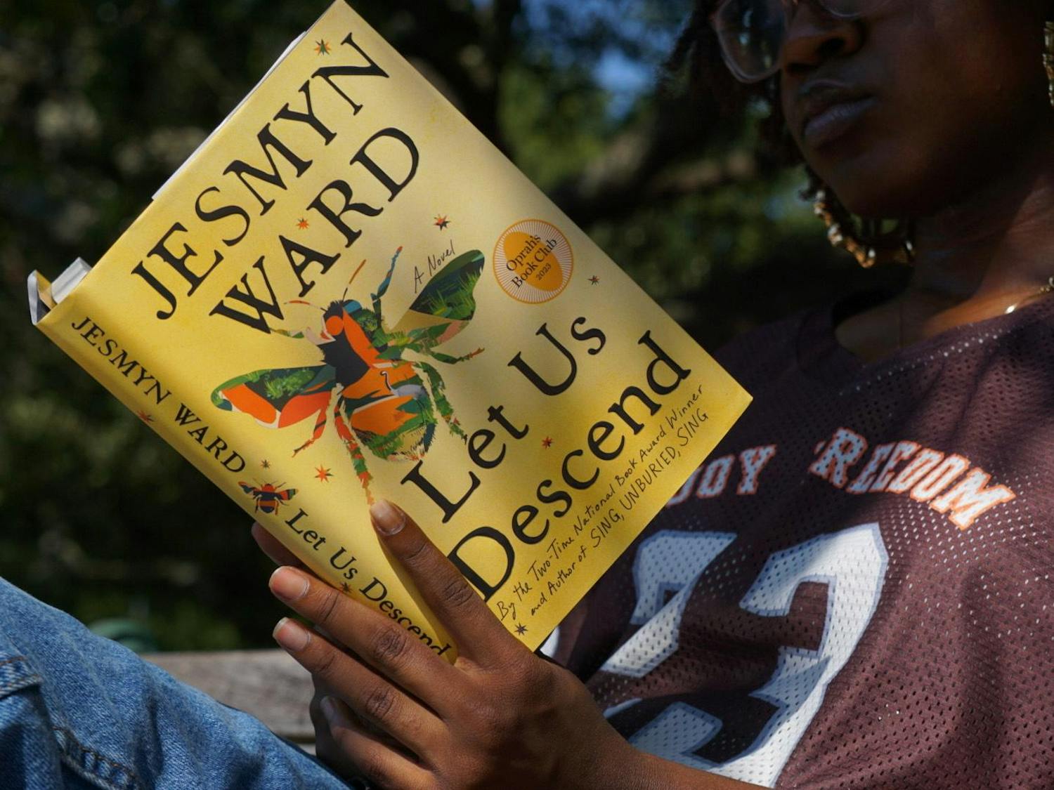 A University of South Carolina student reads “Let Us Descend” by Jesmyn Ward on Sept. 24, 2023. Authors like Ward will participate in the free Fall Literacy Festival this upcoming week, where there will be book signings and other events.