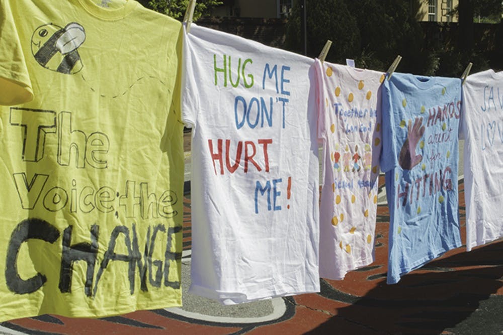 Students drew and painted their original designs and messages on many&nbsp;colored T-shirts.