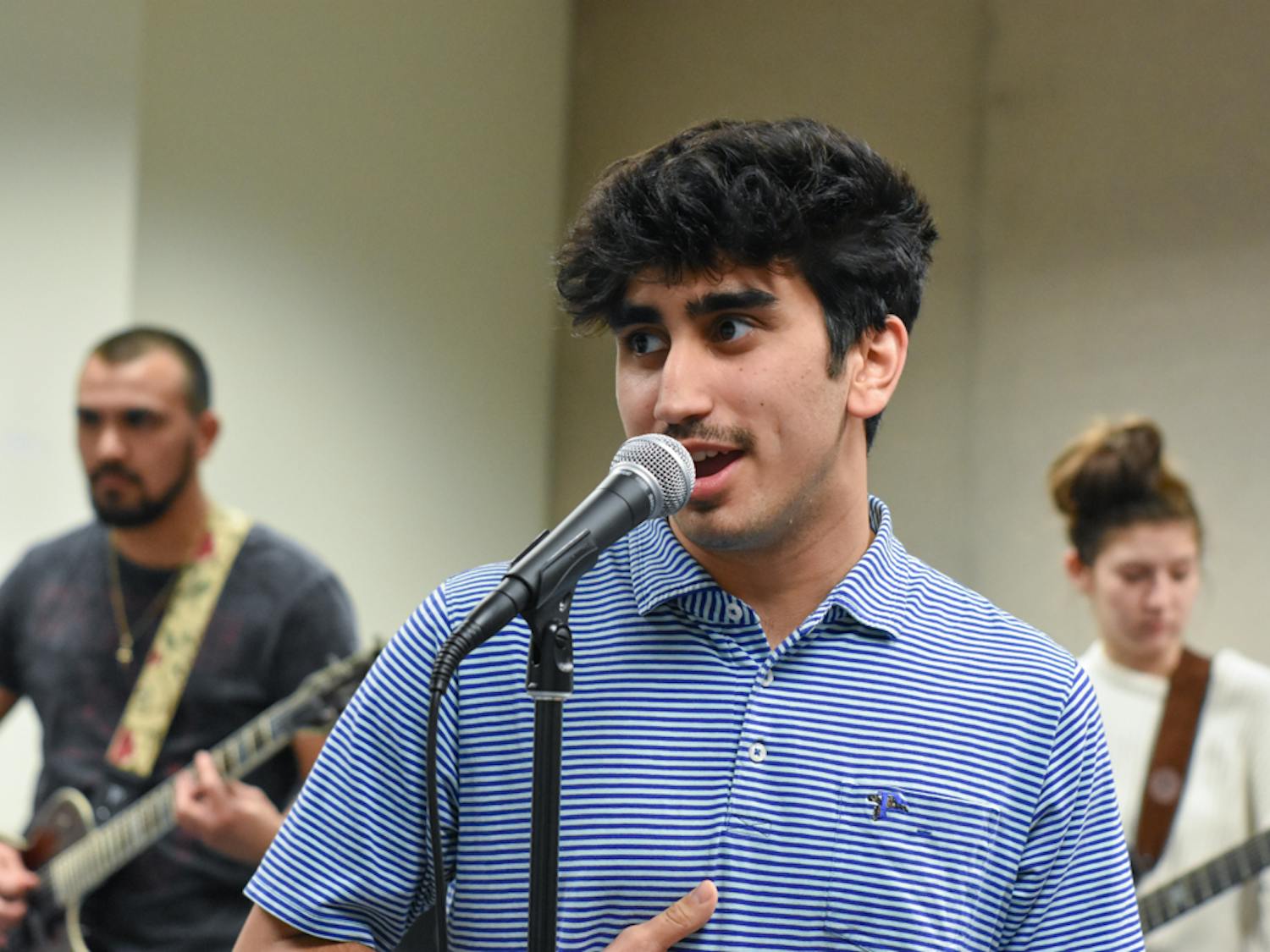First-year music industry studies student Dan Porcelli sings “Wild Thing” by The Troggs as the ensemble practices for its performance on Feb. 13, 2023. The ensemble performed at the Koger Center for students and community members.