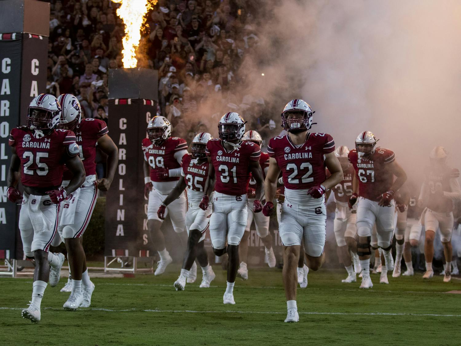 The Gamecocks run out of the tunnel before their matchup against Charlotte Sept. 24, 2022. South Carolina won 56-20.&nbsp;