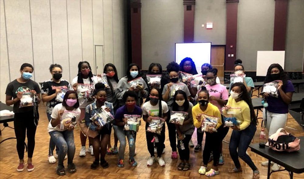 Members of SAVVY partner with Locked with Luv's breast cancer awareness event. The all-female multicultural organization provides many community service events throughout the year.