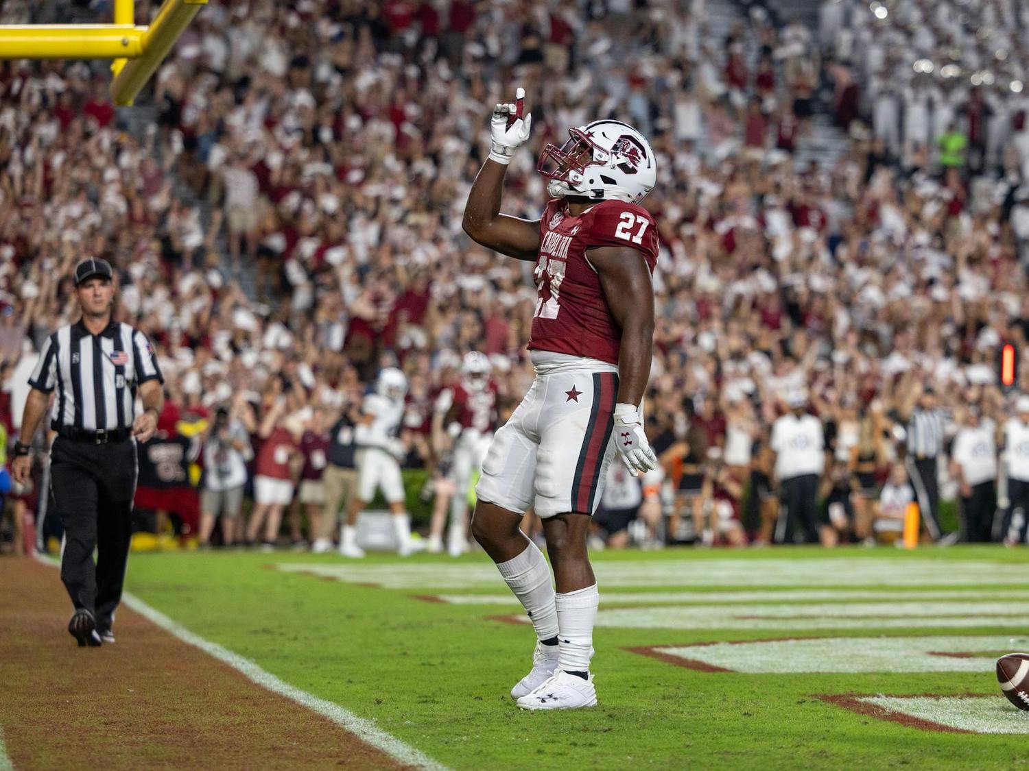 Sixth-year running back Oscar Adaway III points to the sky after scoring a touchdown during South Carolina's game against Akron on Sept. 21, 2024 at Williams-Brice Stadium. Adaway was responsible for two touchdowns in the Gamecocks 50-7 win over the Zips.