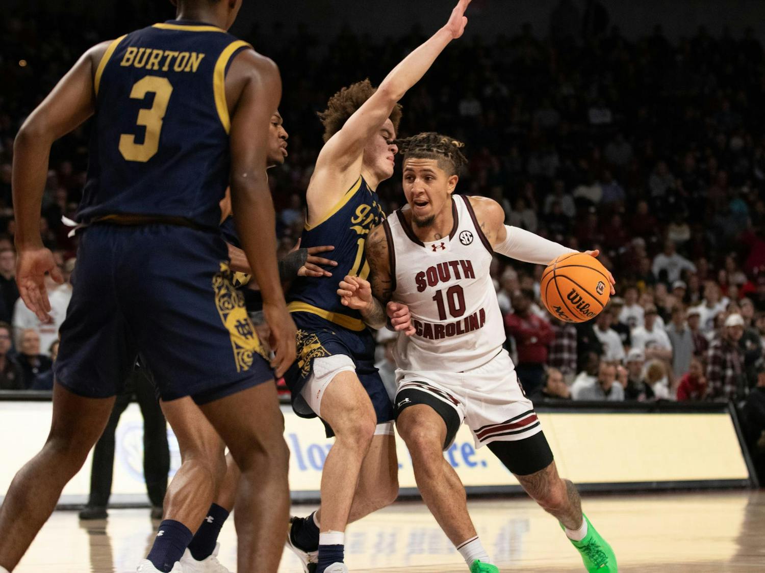 Junior guard Myles Stute drives into a trio of Notre Dame defenders at Colonial Life Arena on Nov. 28, 2023. The Gamecocks won the game 65-53, but Stute struggled with just 1 point on 0-5 shooting.