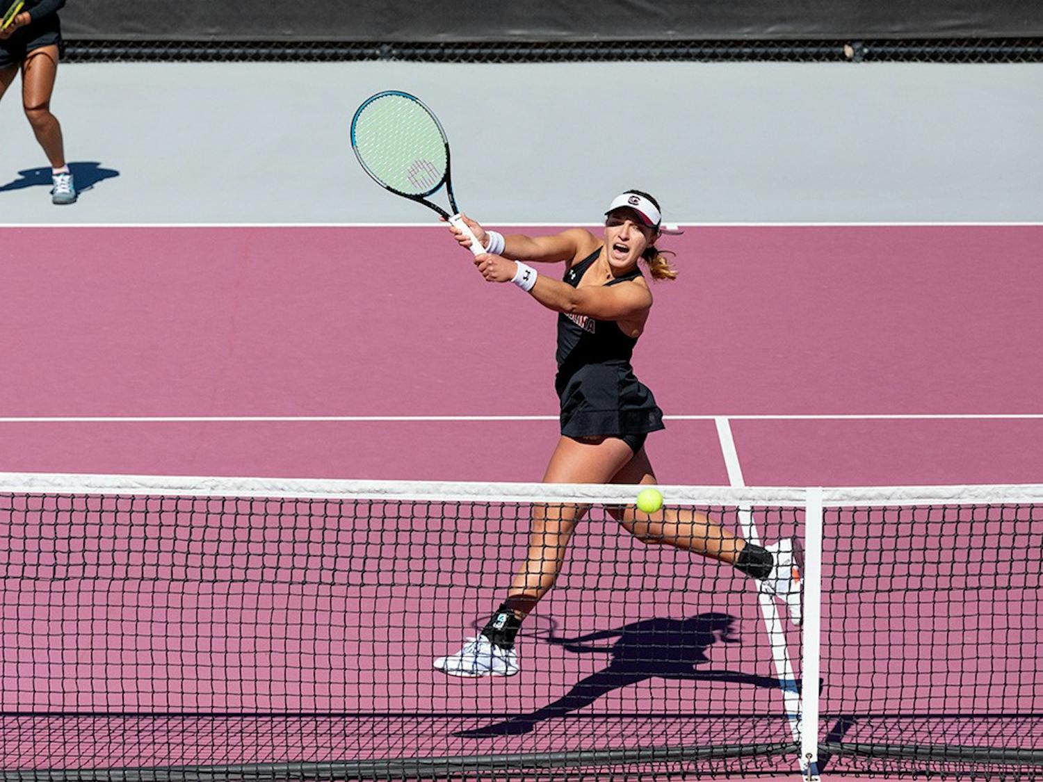 South Carolina’s junior Ana Cruz blocks Clemson’s serve during doubles on Sunday, Feb. 20, 2022. 