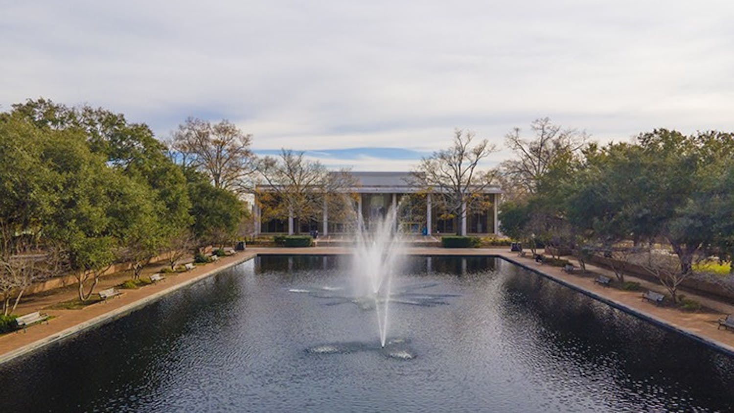 Aerial shot of Thomas Cooper Library showing the reflecting pool, which has benches, often used as study spots, lining it.