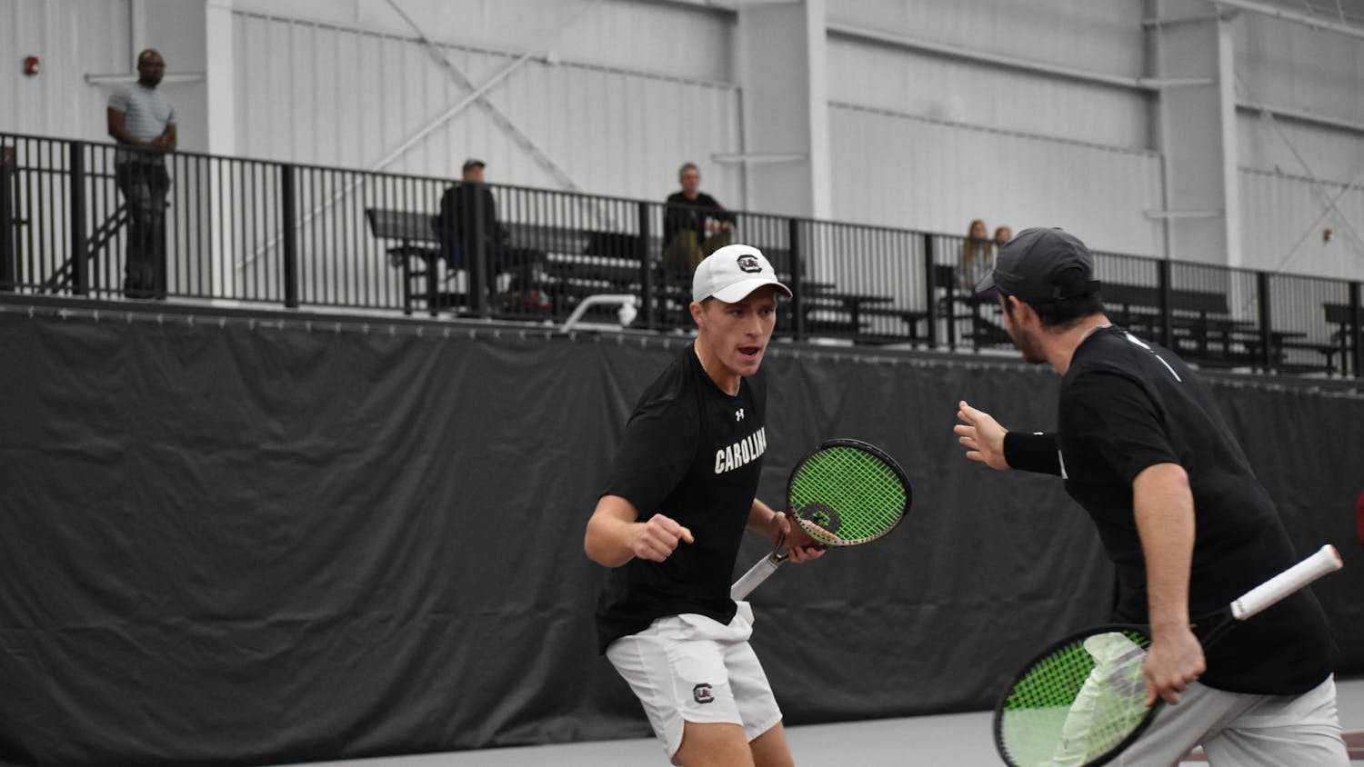 Junior James Story and graduate Jake Beasley celebrate after winning a point in their doubles match on day two of the ITA Kickoff Weekend event at the Carolina Indoor Tennis Center on Jan. 29, 2023. South Carolina beat N.C. State 4-0, making it the winner of the ITA tournament.&nbsp;