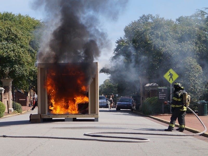 The Columbia Fire Department set a mock-dorm room ablaze during Friday’s fire safety fair on Greene Street.