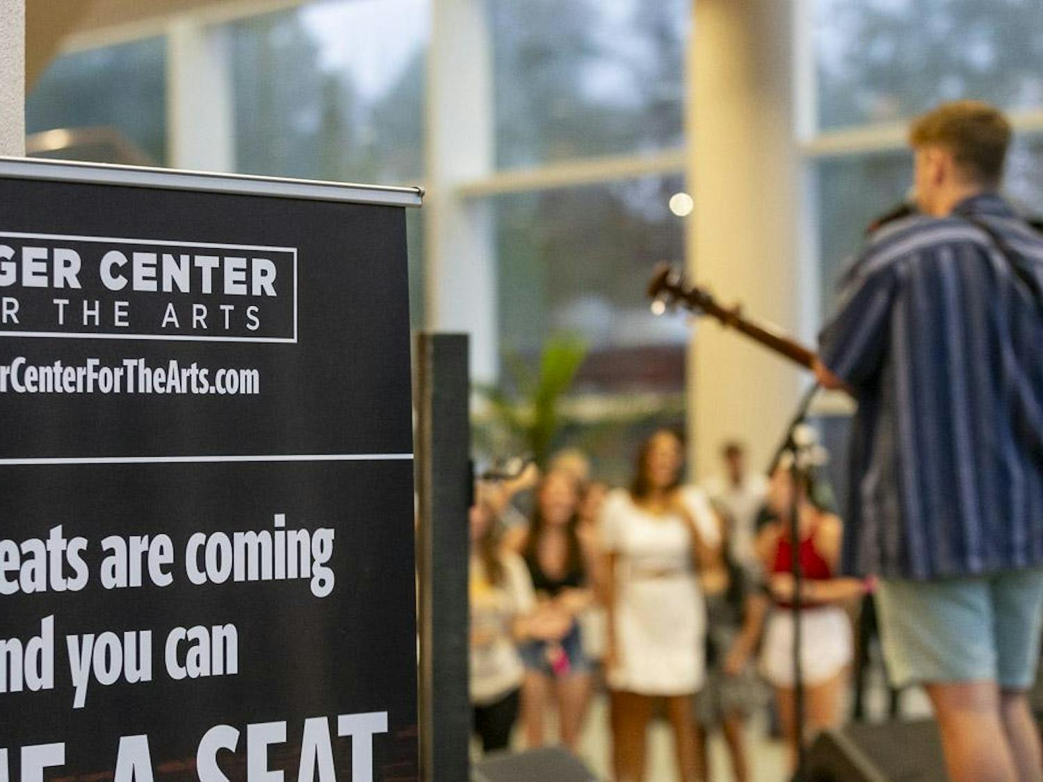 A Koger Center sign describing the venue's improved seating sits behind the stage during the "Country at Koger" event on Aug. 27, 2023. The event, hosted by Carolina Productions, featured performances from country artists Jordana Bryant, Vincent Mason and Will Cullen.
