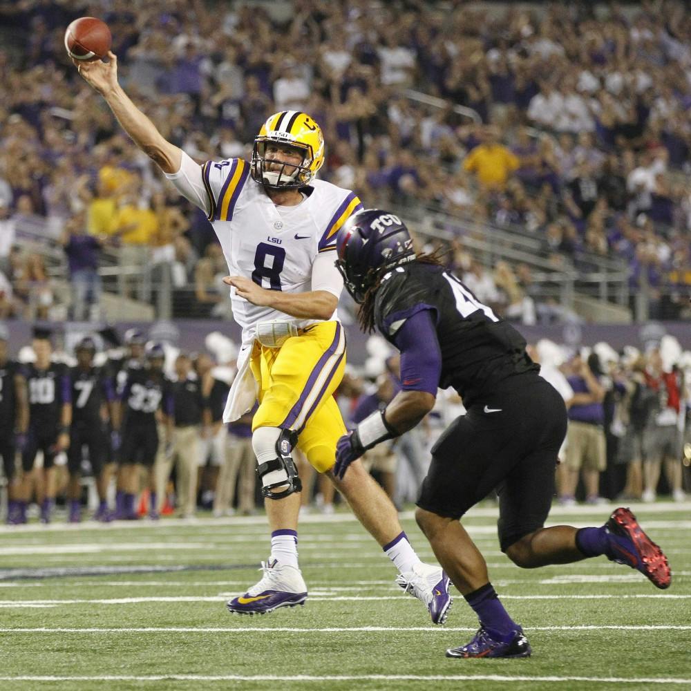 Louisiana quarterback Zach Mettenberger (8) throws under pressure from Texas Christian's Jonathan Anderson in the second quarter at Cowboys Stadium in Arlington, Texas, on Saturday, August 31, 2013. (Ron T. Ennis/Fort Worth Star-Telegram/MCT)