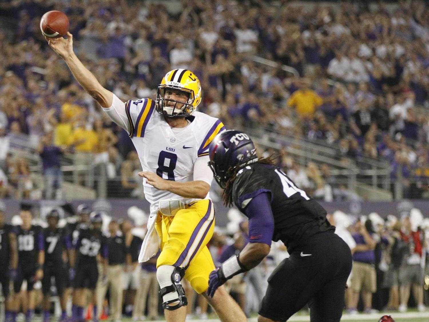 Louisiana quarterback Zach Mettenberger (8) throws under pressure from Texas Christian's Jonathan Anderson in the second quarter at Cowboys Stadium in Arlington, Texas, on Saturday, August 31, 2013. (Ron T. Ennis/Fort Worth Star-Telegram/MCT)