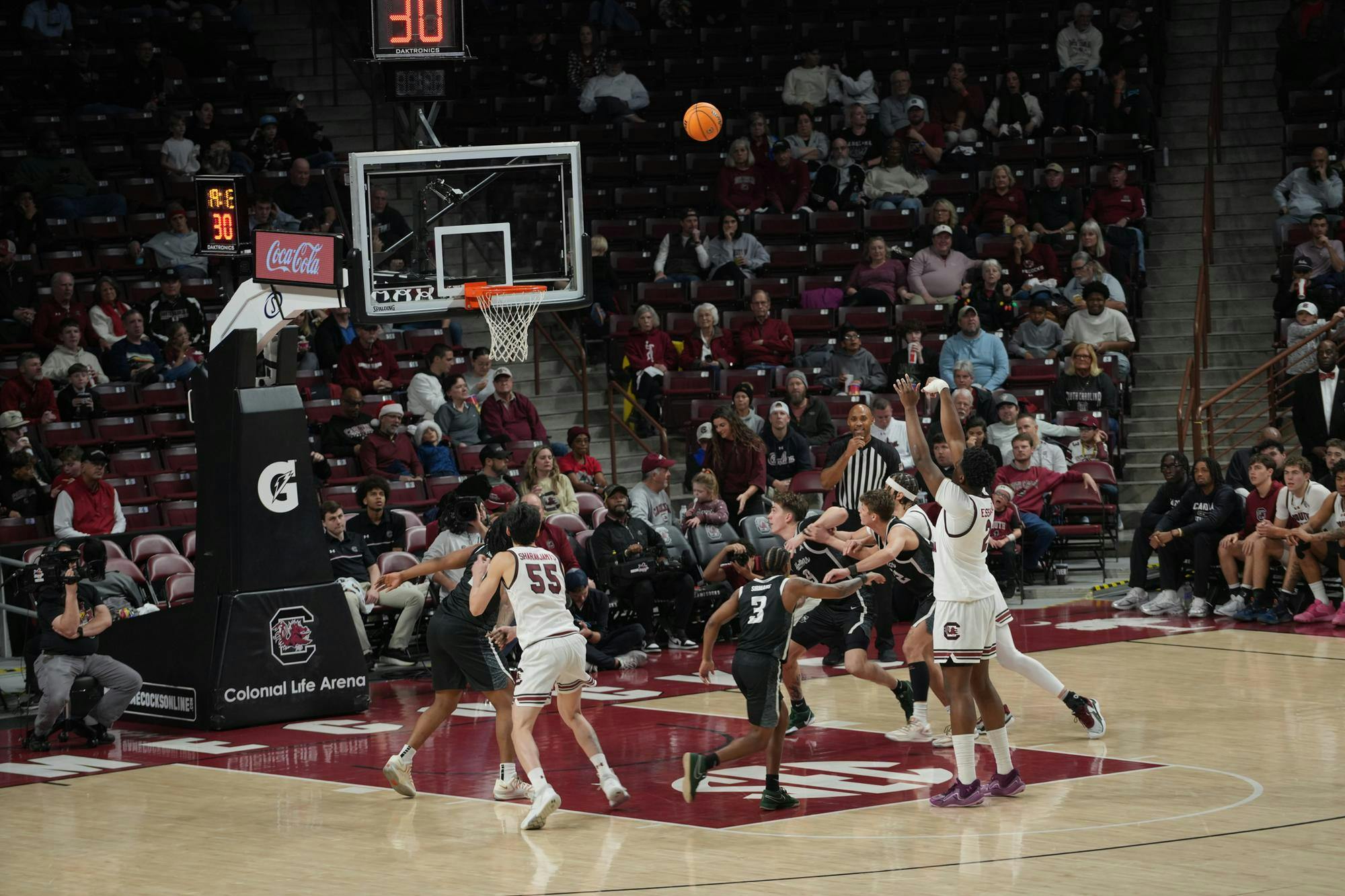 A South Carolina guard rises for a jumper while teammates and defenders crash the paint at Colonial Life Arena. South Carolina controlled the pace all night on Dec. 6, 2025, finishing with an 82–51 victory in Columbia, South Carolina.