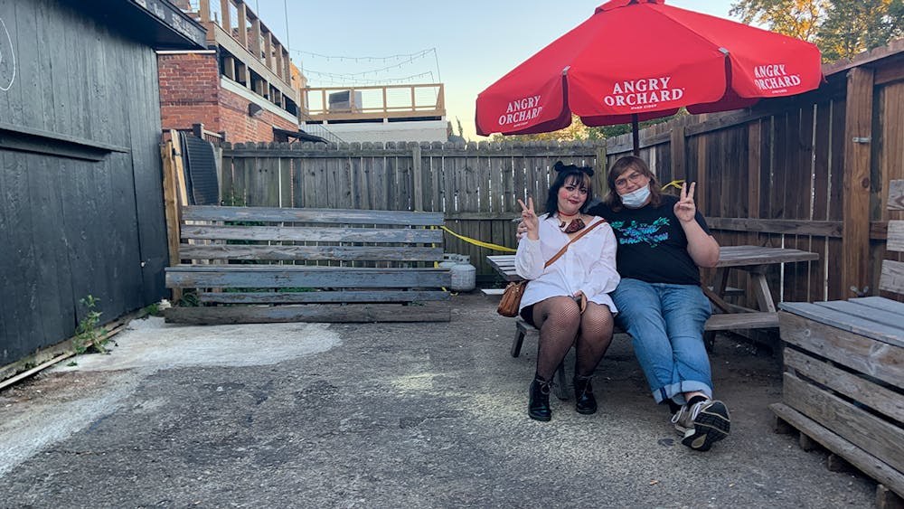 <p>Aubrey Key and his partner, Candice Turner, hang out at the New Brookland Tavern before a performance.</p>