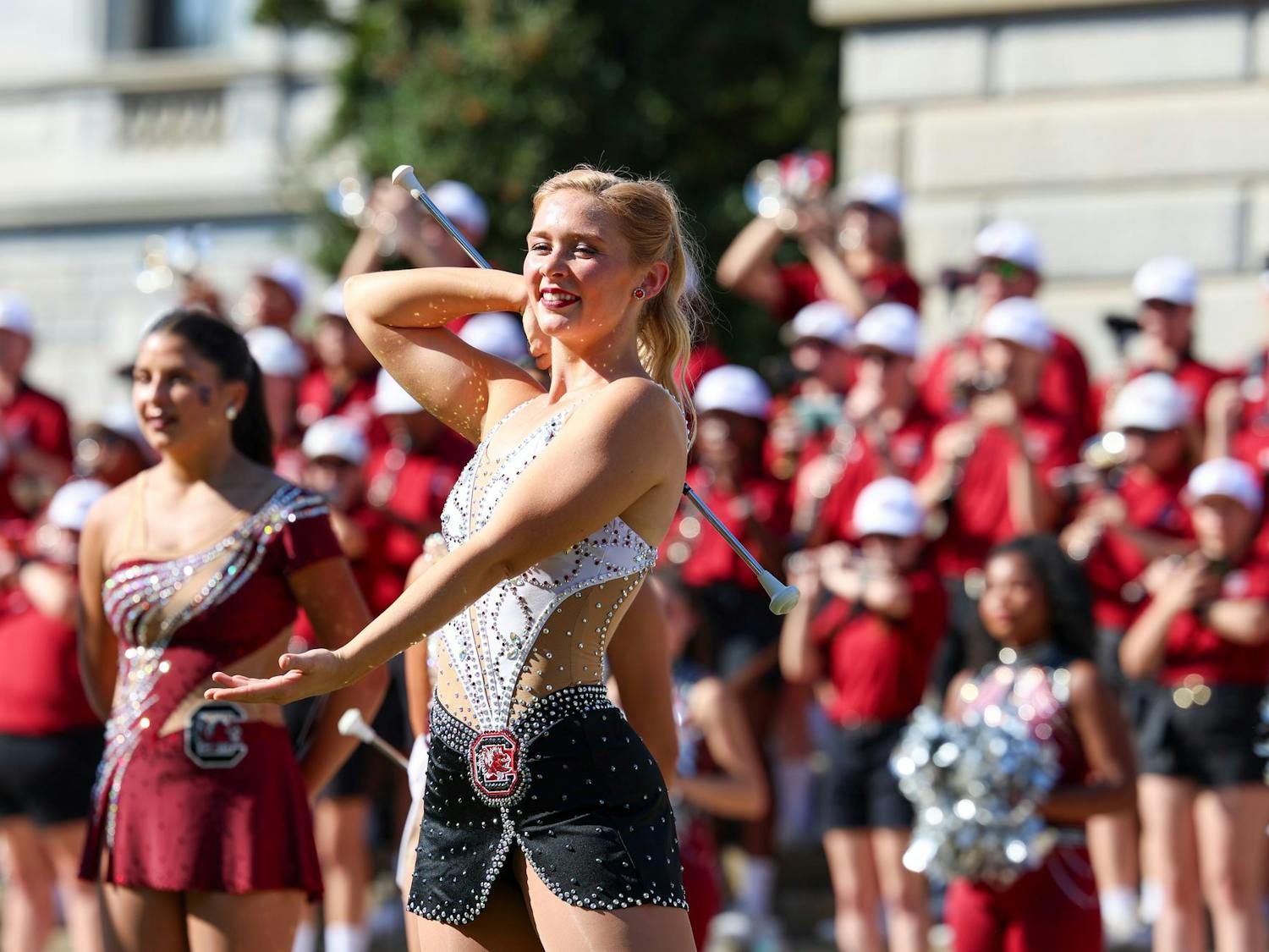 Carolina Band feature twirler Alanna Hopkins performs with the band outside of the South Carolina State House on Oct. 26, 2024. The "Mighty Sound of the Southeast" practiced marching and put on a free concert to prepare for their performance in the Macy's Thanksgiving Day Parade next month.