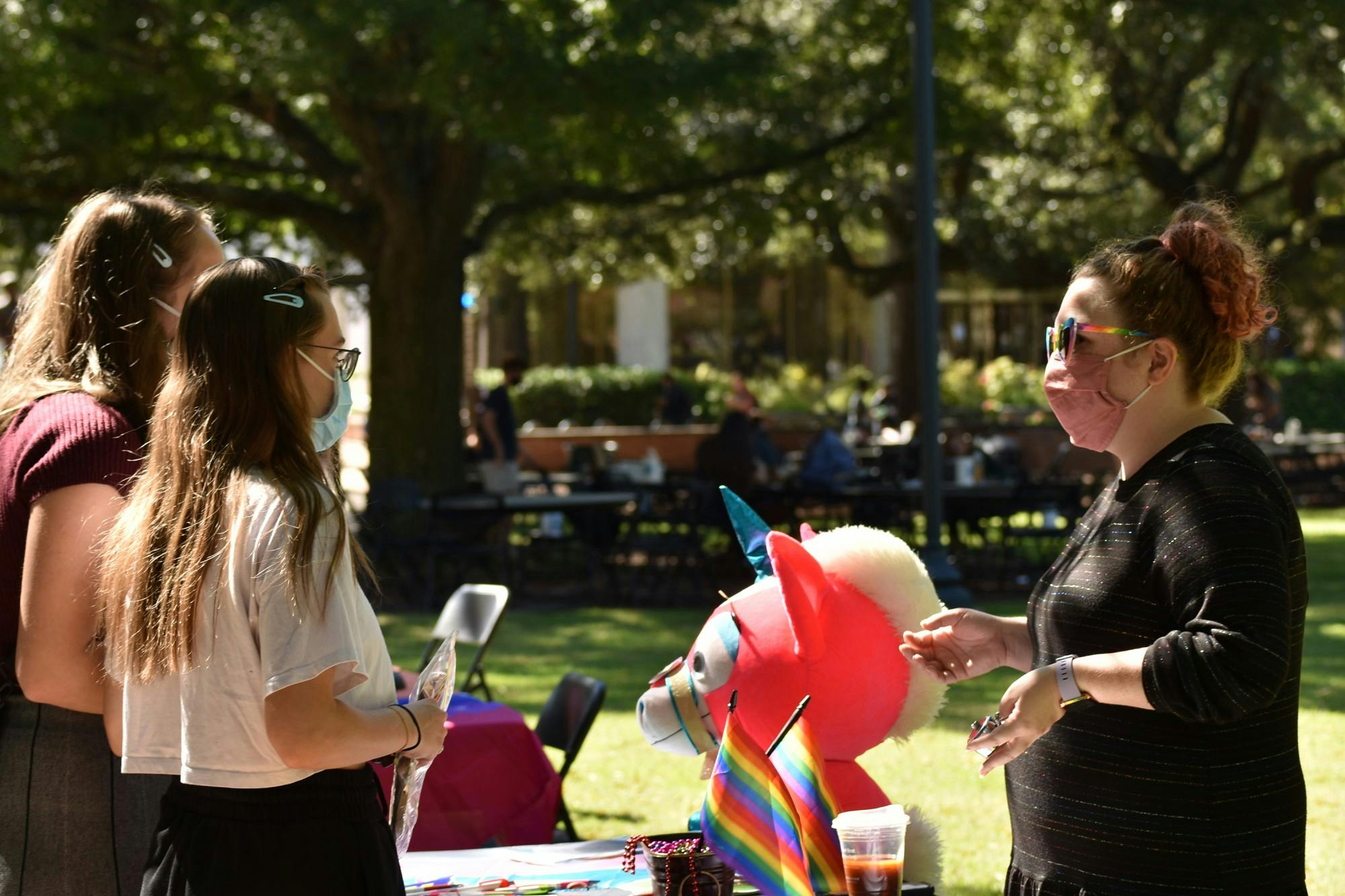 Students receive information about the LGBTQ+ History Month Kick-Off. The kickoff happened on Davis Field Thursday.