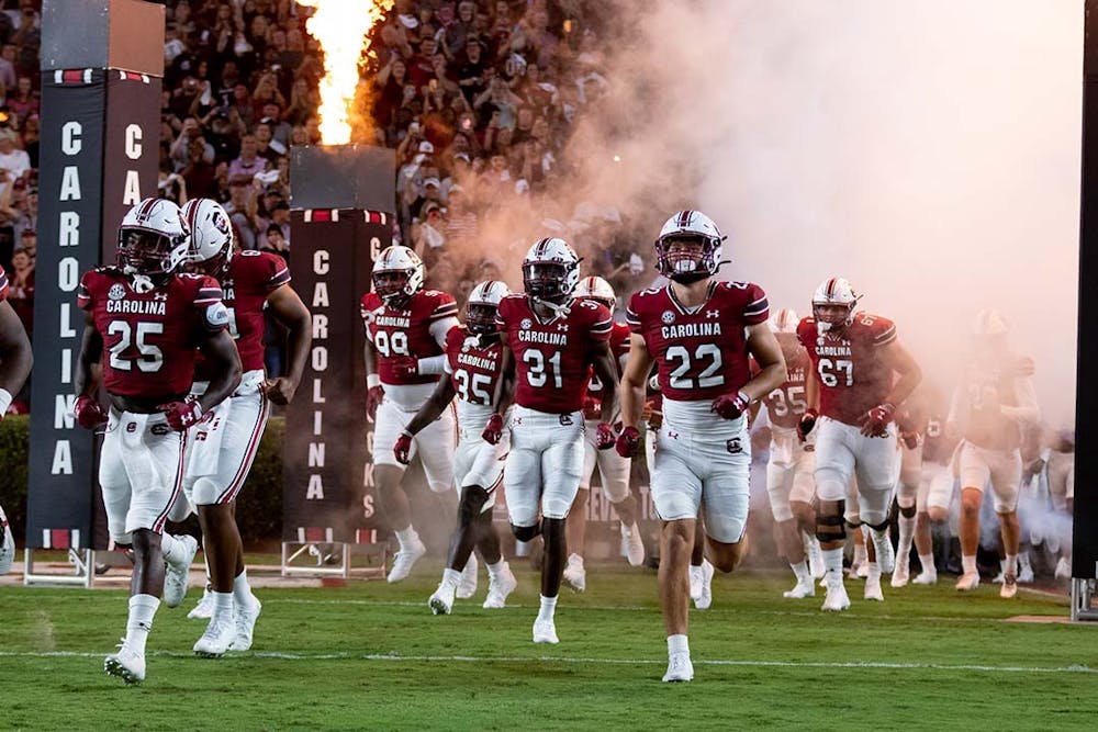 FILE — The Gamecocks run out of the tunnel at Williams-Brice Stadium on Sept. 24, 2022. The Gamecocks won against the Charlotte 49ers 56-20.