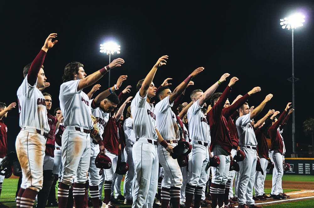 <p>The Gamecocks gather together to celebrate their win against Gardner-Webb on Tuesday, March 15, 2022. The Gamecocks won 12-0 against Gardner-Webb.</p>