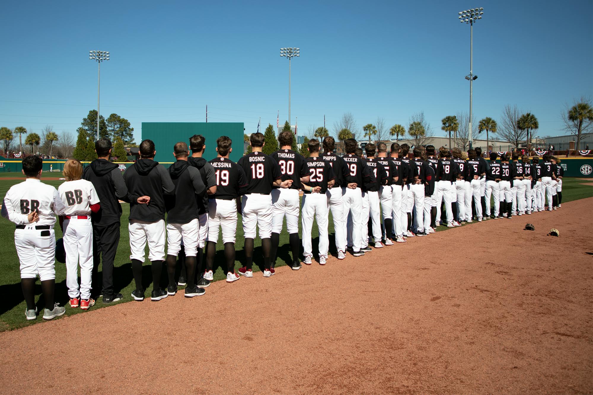 USC's baseball team stands for the singing of the National Anthem before playing the University of North Georgia on Feb. 20, 2022.