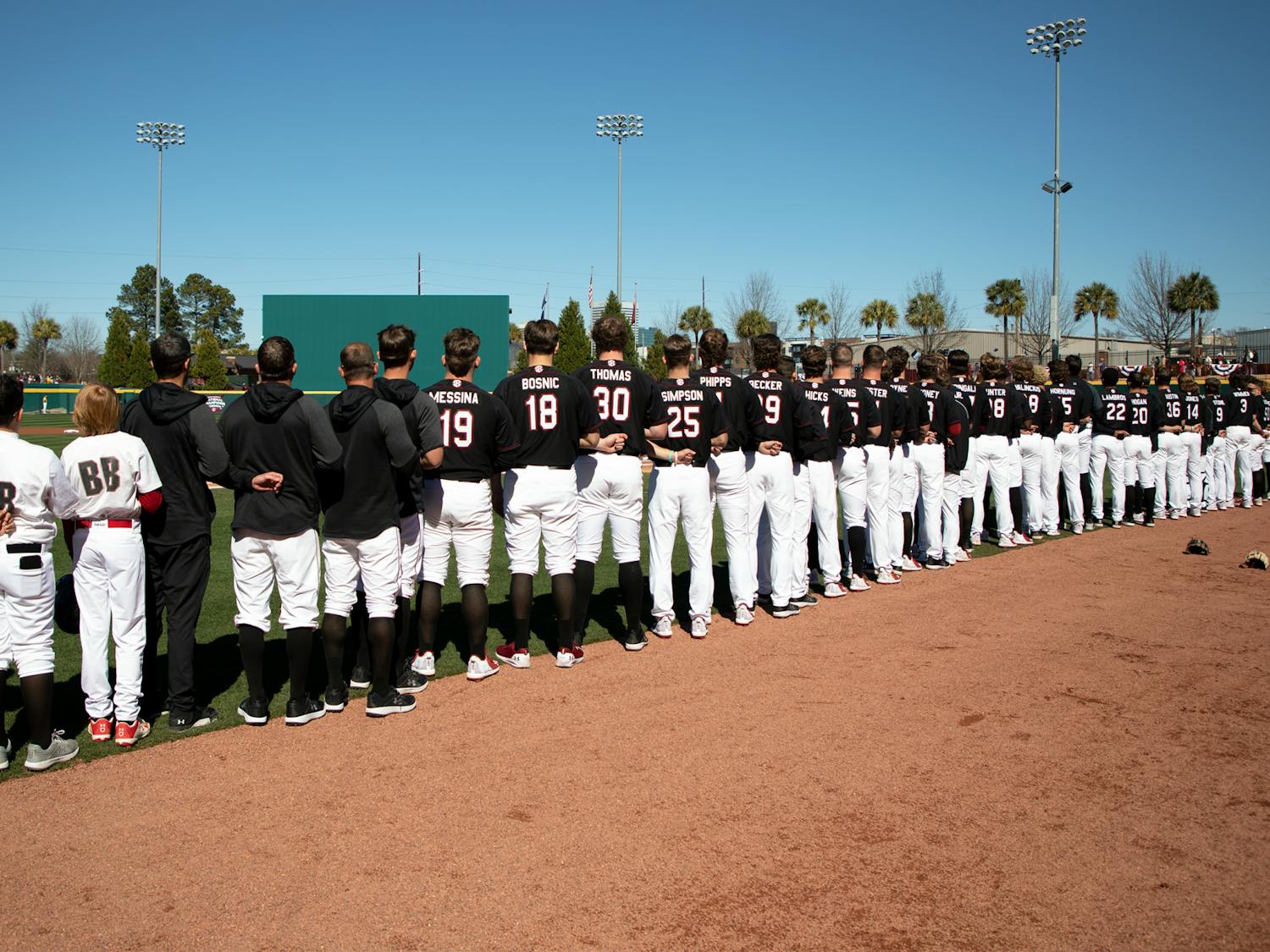 USC's baseball team stands for the singing of the National Anthem before playing the University of North Georgia on Feb. 20, 2022.
