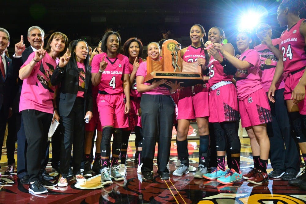 The South Carolina Lady Gamecocks beat the Georgia Bulldogs 61 to 51, making the Lady Gamecocks the SEC champions for 2016. UofSC President Harry Pastides, Assoc. Head Coach Lisa Boyer, and Head Coach Dawn Staley stand proudly with the Lady Gamecocks after one of the most intensive games of the season. South Carolina Gamecocks vs Georgia Bulldogs. Colonial Life Arena, Columbia, SC. February 18, 2016