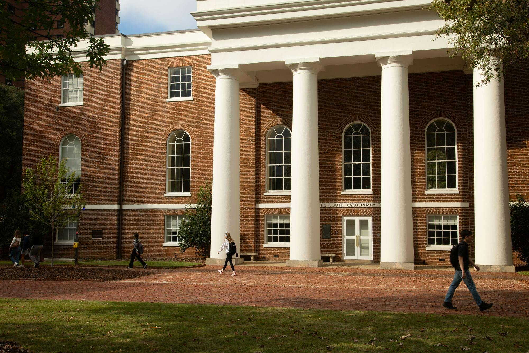 On Nov. 11, 2024, students pass by the South Caroliniana Library in the Horseshoe on the way to class. The South Caroliniana Library has served as the university’s library for 100 years and is listed on the National Register of Historic Places.