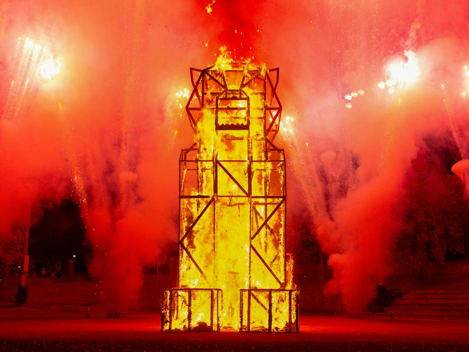 The tiger statue quickly burns, accompanied by a firework show, during USC’s annual Tiger Burn event on Nov. 19, 2025, at the Blatt Field. The audience cheered as they watched the event.