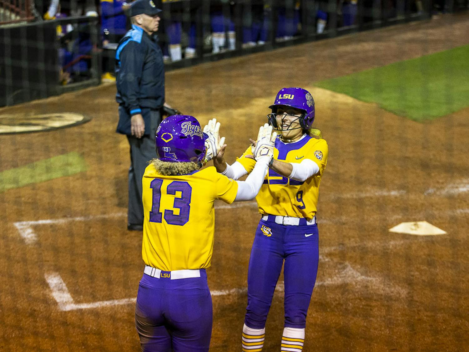 LSU junior infielder Danieca Coffey (left) and sophomore outfielder Madilyn Giglio (right) celebrate after making two RBIs due to an error on South Carolina's offense during the second inning during game two of the doubleheader on March 13, 2023. The Tigers beat the Gamecocks 5-1 at Beckham Field in the second game of the night.&nbsp;