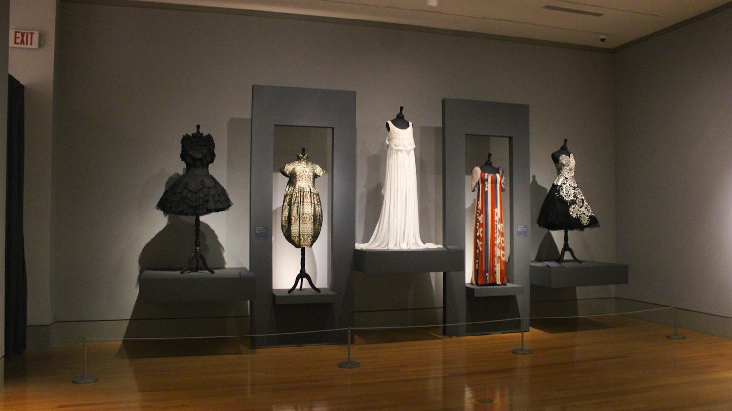 Five garments stand on display for “Rendez-Vous,” at the Columbia Museum of Art on Jan. 9, 2023. The exhibit displays over fifty garments designed by fashion icon Lee Alexander McQueen, as well as photographs of the designer and his work, by Ann Ray.