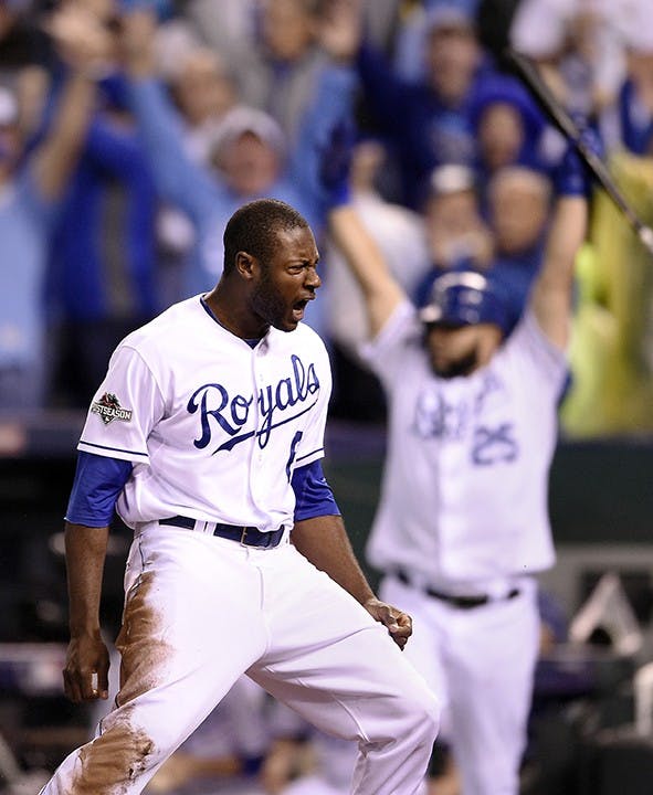 The Kansas City Royals&apos; Lorenzo Cain celebrates scoring on an RBI single in the eighth inning by Eric Hosmer against the Toronto Blue Jays during Game 6 of the ALCS on Friday, Oct. 23, 2015, at Kauffman Stadium in Kansas City, Mo. (Shane Keyser/Kansas City Star/TNS)