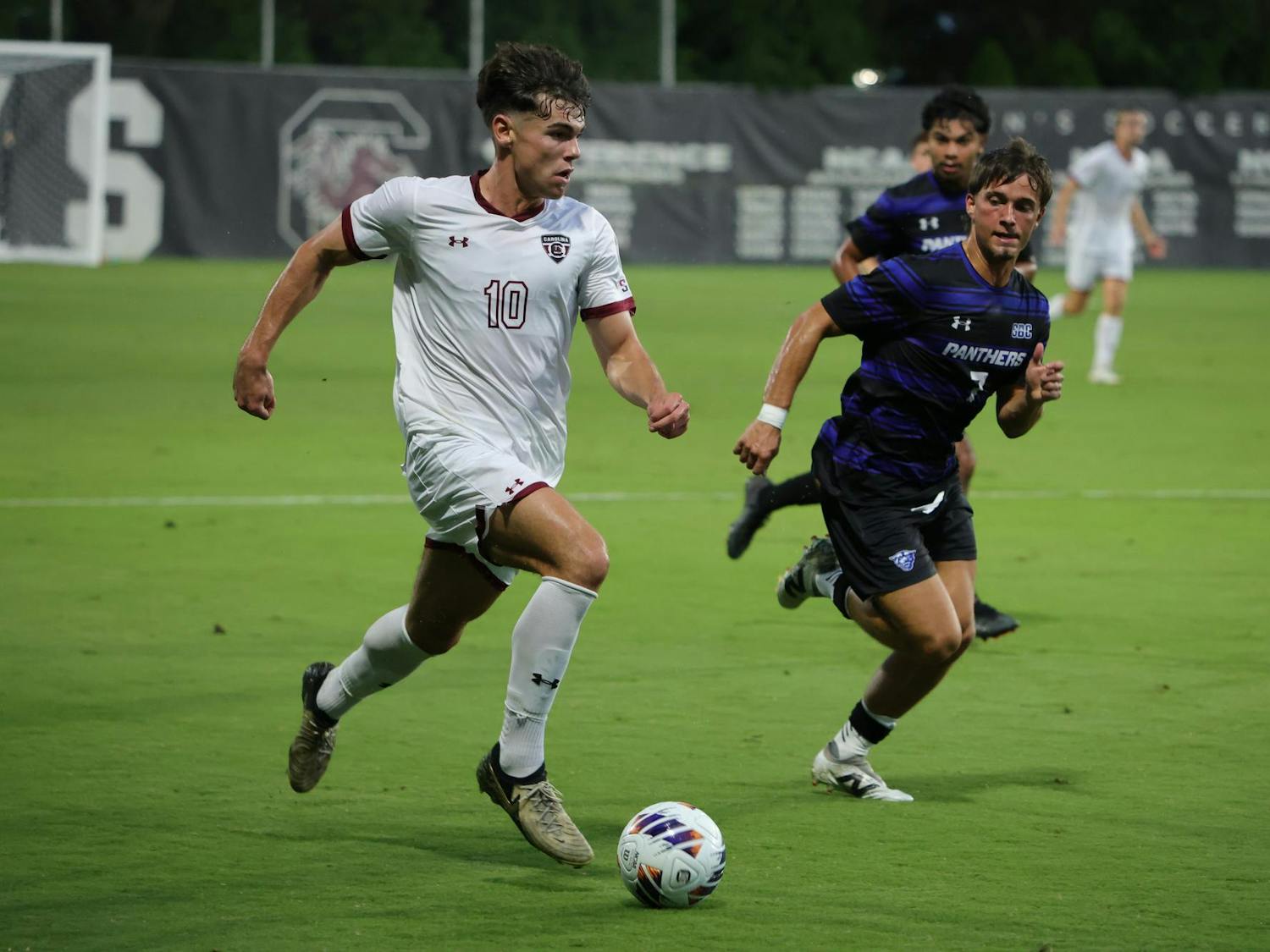 Senior midfielder Ethan Ballek sprints downfield with the ball while a Georgia State defender gives chase during South Carolina’s match at Eugene E. Stone Stadium on Friday, Sept. 19, 2025.