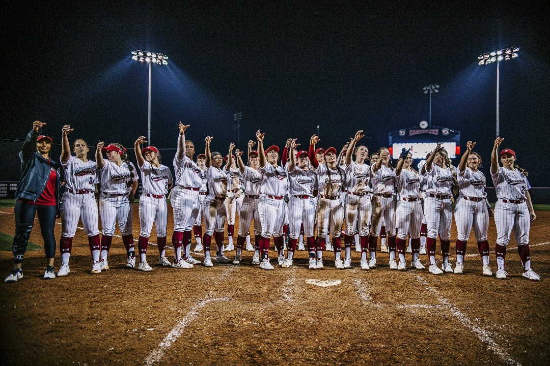 The Gamecock softball team offers a toast to the crowd after winning their home opener against the College of Charleston at Carolina Softball Stadium at Beckham Field on February 15, 2023. The Gamecocks beat the Cougars 8-0.&nbsp;