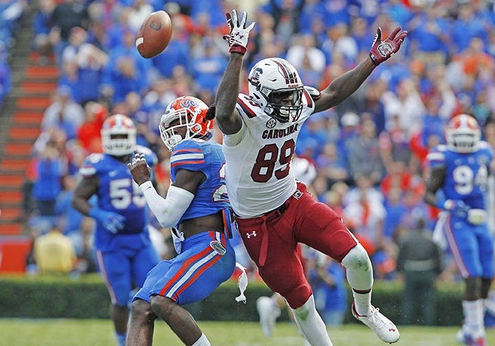 Florida defensive back Marcus Maye (20) is called for a pass interference after bumping South Carolina tight end Jerell Adams (89) on a pass play in the fourth quarter at Ben Hill Griffin Stadium in Gainesville, Fla., Saturday, Nov. 15, 2014. The visiting Gamecocks won, 23-20, in overtime. (Gerry Melendez/The State/MCT)