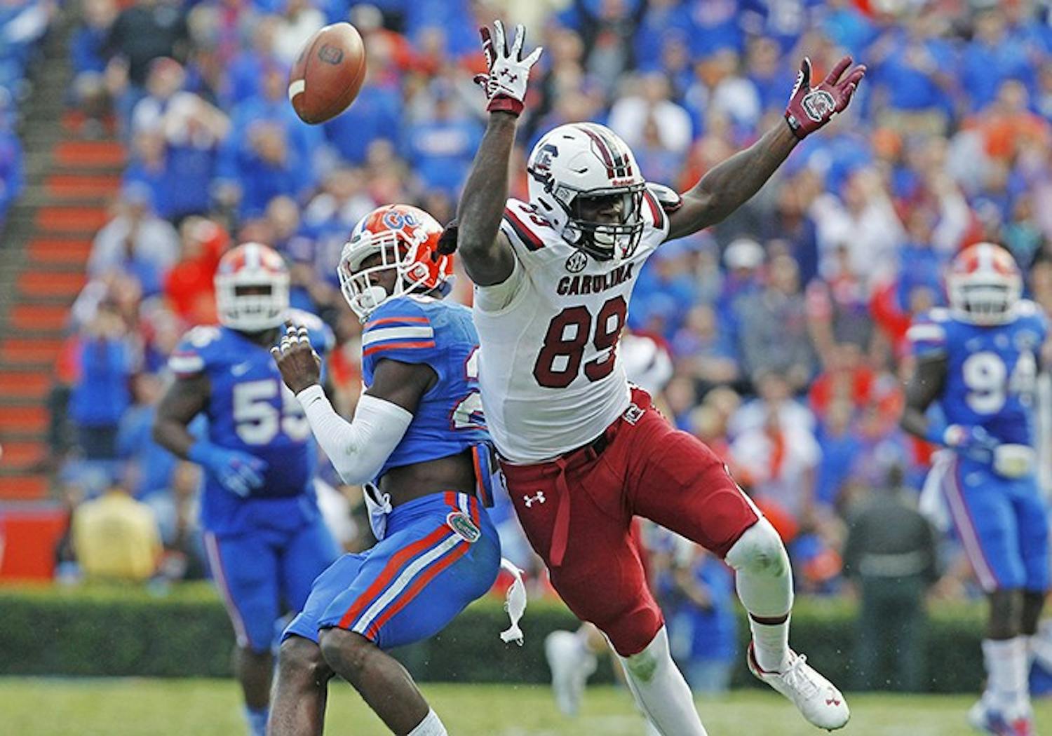 Florida defensive back Marcus Maye (20) is called for a pass interference after bumping South Carolina tight end Jerell Adams (89) on a pass play in the fourth quarter at Ben Hill Griffin Stadium in Gainesville, Fla., Saturday, Nov. 15, 2014. The visiting Gamecocks won, 23-20, in overtime. (Gerry Melendez/The State/MCT)