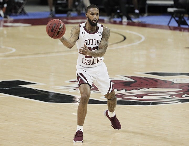 Redshirt senior guard Seventh Woods makes a pass in South Carolina's 59-75 loss to Mississippi State. The Gamecocks fell to 5-7 after the loss.