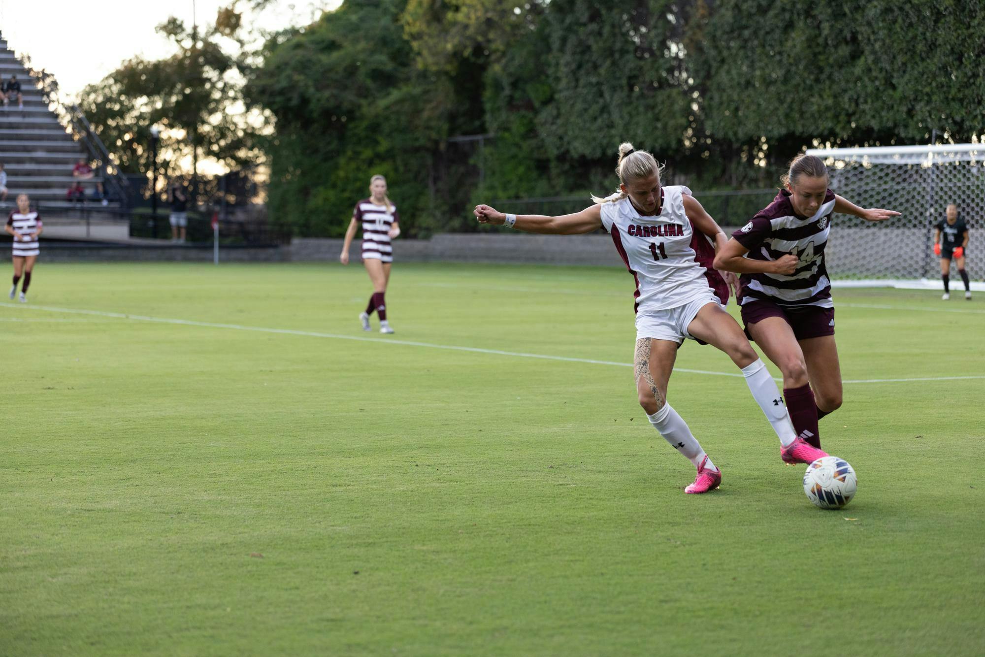 Senior midfielder Kinley Brown stabs the ball away from a defender in the women’s soccer game against Texas A&amp;M on Oct. 19, 2025. Brown had to recover to kick the ball away after a South Carolina loss of possession.