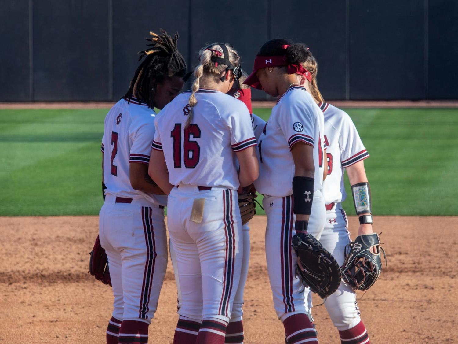 Freshman pitcher Sage Mardjetko rallies her teammates together during an infielder meeting on March 14, 2024. The Gamecocks went into extra innings and seized the win in the bottom of the eighth. 