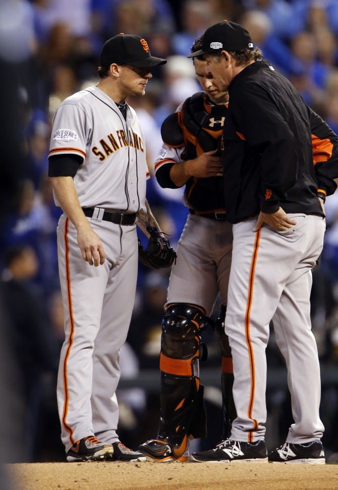 The San Francisco Giants' pitching coach Dave Righetti, right, and catcher Buster Posey visit pitcher Jake Peavy on the mound during the second inning in Game 6 of the World Series at Kauffman Stadium in Kansas City, Mo., on Tuesday, Oct. 28, 2014. (Josie Lepe/Bay Area News Group/MCT)