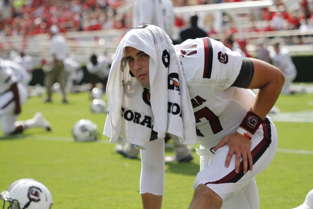 	Dylan Thompson warms up before the game.