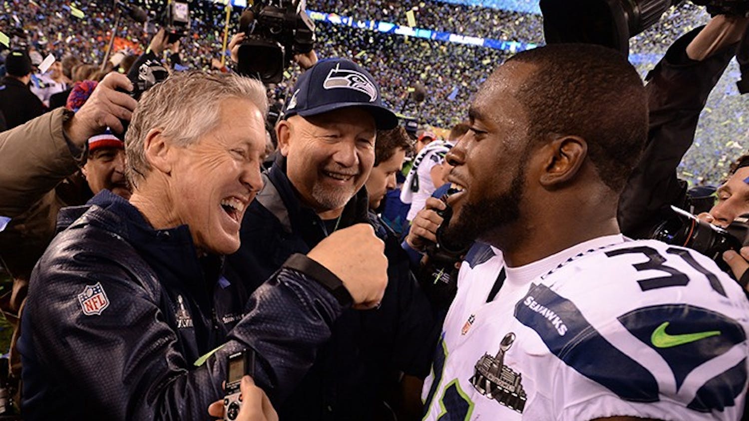 Head coach Pete Carroll of the Seahawks celebrates with Kam Chancellor (31) after Seattle wins Super Bowl XLVIII at MetLife Stadium in East Rutherford, N.J., on Sunday, Feb. 2, 2014. The Seattle Seahawks defeated the Denver Broncos, 43-8. (Lionel Hahn/Abaca Press/MCT)