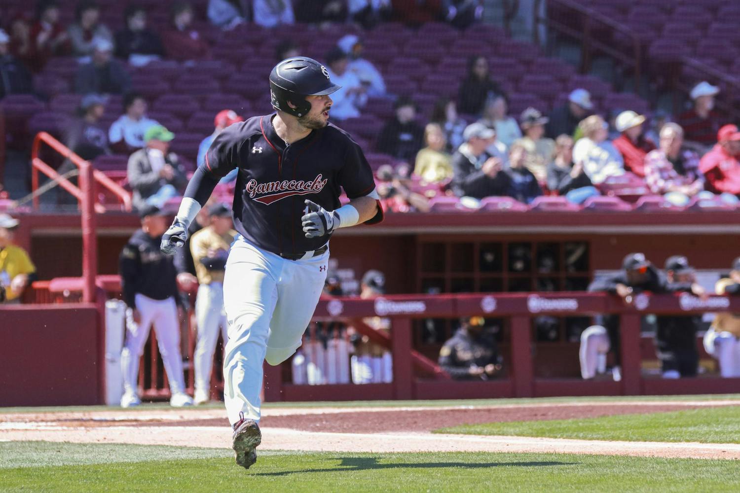 FILE- Junior catcher Cole Messina runs towards first base after hitting a pitch at Founders Park on March 24, 2024. Messina secured his 100th career hit earlier in the 2024 鶹С򽴫ý.