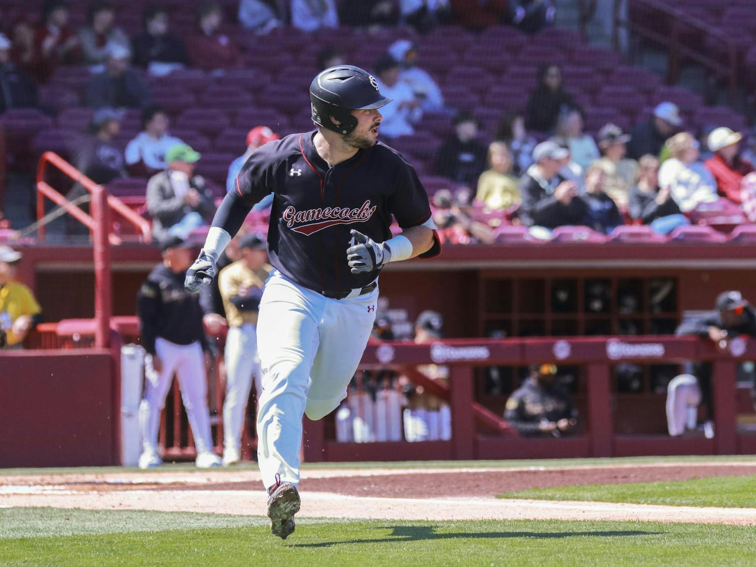FILE- Junior catcher Cole Messina runs towards first base after hitting a pitch at Founders Park on March 24, 2024. Messina secured his 100th career hit earlier in the 2024 season.