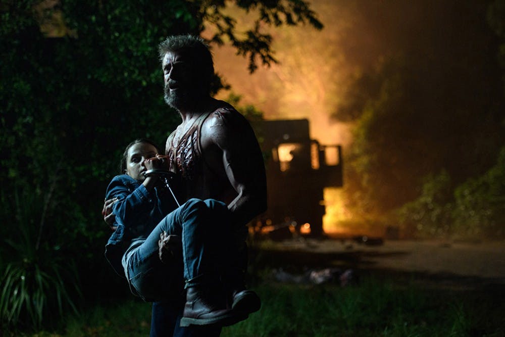 Logan/Wolverine (Hugh Jackman) tries to protect the young mutant Laura (Dafne Keen) in "Logan." (Ben Rothstein/20th Century Fox) 