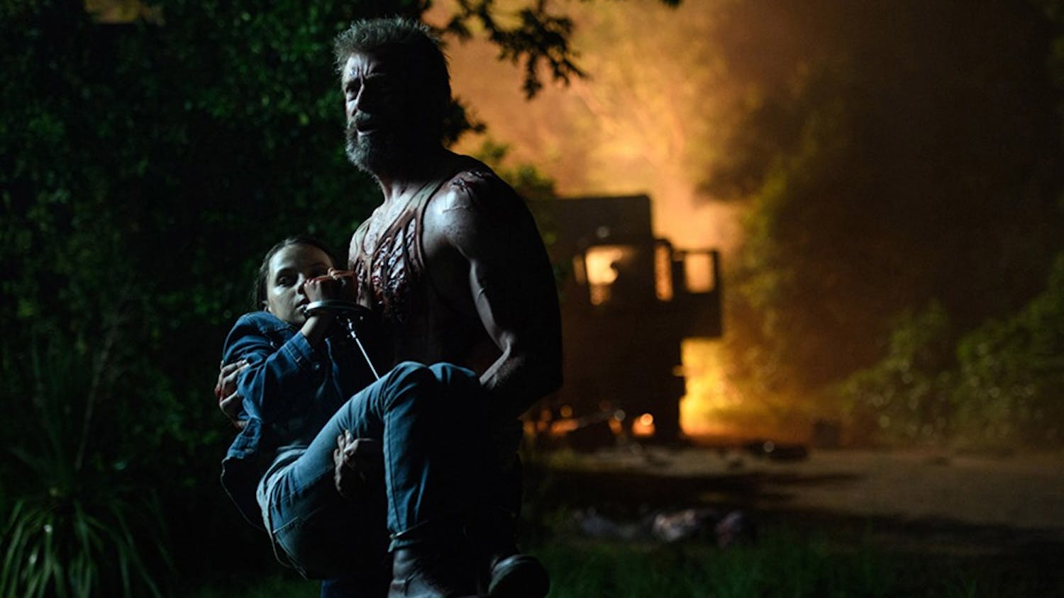 Logan/Wolverine (Hugh Jackman) tries to protect the young mutant Laura (Dafne Keen) in "Logan." (Ben Rothstein/20th Century Fox) 