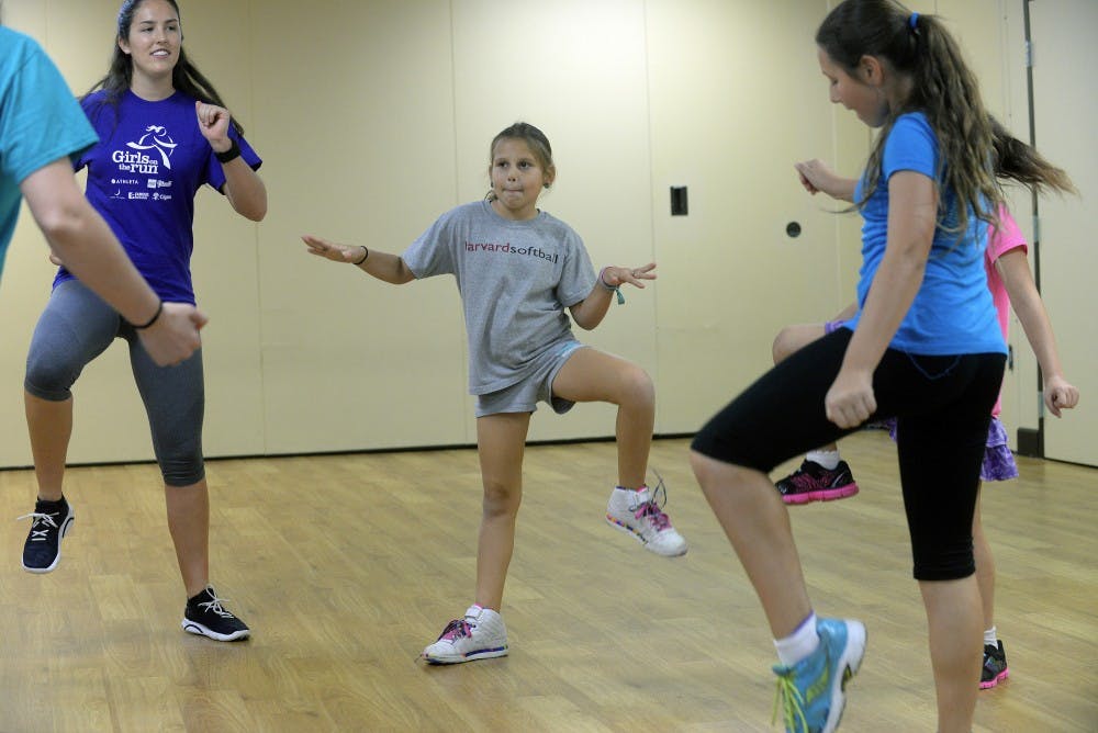 Nine-year-old Shoshanna Faerman, center, gets in her calisthenics workout on Sunday, Feb. 22, 2015. To fight obesity and improve girls' self-confidence, Girls on the Run meets every Sunday at B'nai Torah Congregation in Boca Raton, Fla. It's part of a national organization that encourages teamwork, physical fitness and positive attitudes for girls from eight to 13. (Scott Fisher/Sun Sentinel/TNS)