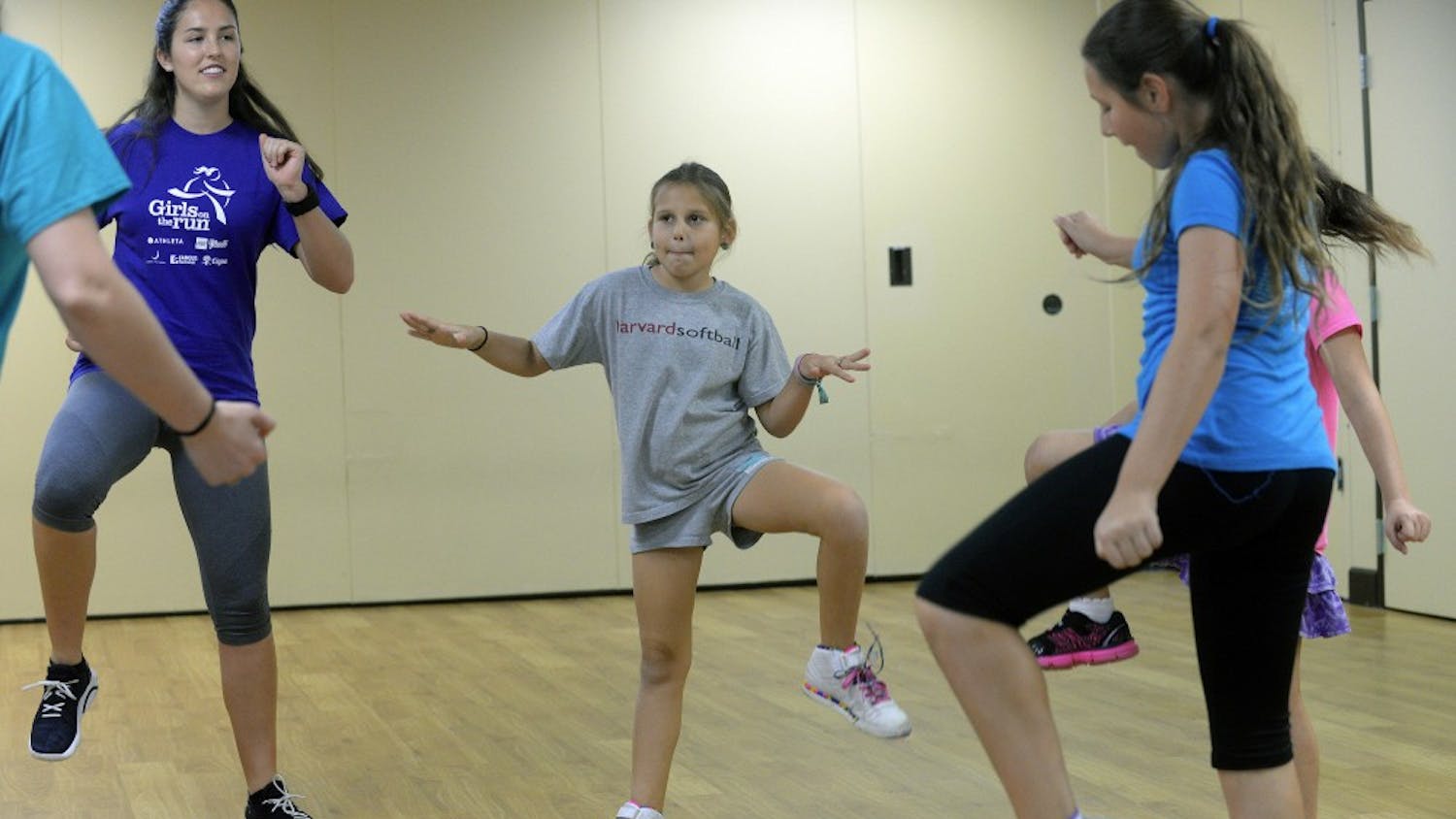 Nine-year-old Shoshanna Faerman, center, gets in her calisthenics workout on Sunday, Feb. 22, 2015. To fight obesity and improve girls' self-confidence, Girls on the Run meets every Sunday at B'nai Torah Congregation in Boca Raton, Fla. It's part of a national organization that encourages teamwork, physical fitness and positive attitudes for girls from eight to 13. (Scott Fisher/Sun Sentinel/TNS)