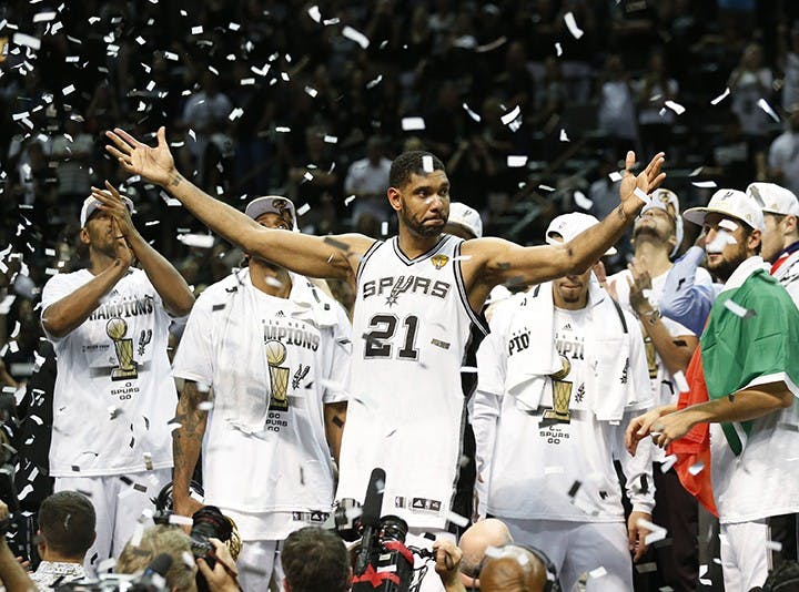 The San Antonio Spurs celebrate with the NBA Championship Larry O&apos;Brien trophy after defeating the Miami Heat, 104-87, in Game 5 of the NBA Finals at the AT&amp;T Center in San Antonio, Texas, on Sunday, June 15, 2014. (Al Diaz/Miami Herald/MCT)