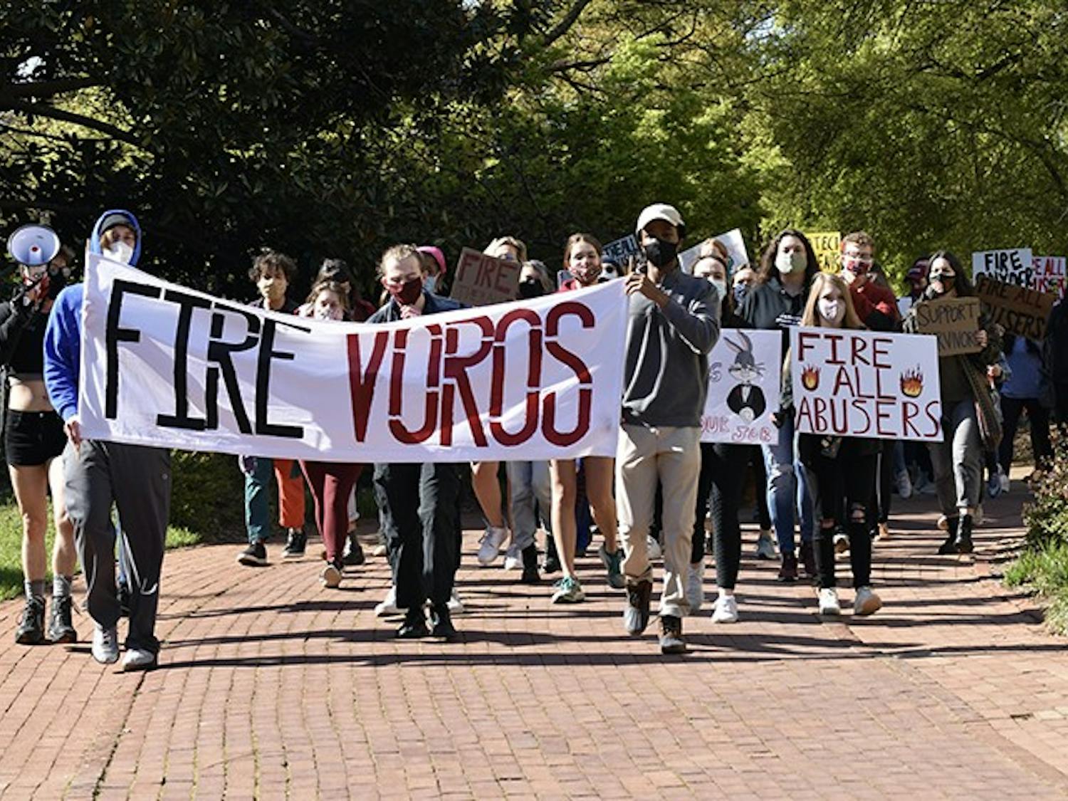 Protestors march from Pickens Street Bridge to the President's House holding signs that demand the firing of all professors accused of sexual misconduct.&nbsp;