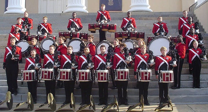 The 2004 Carolina Band drumline stands together at the steps of the Longstreet Theatre.